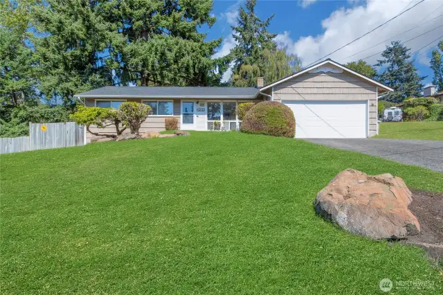 Gorgeous front yard complete with a rose bush by the door :)