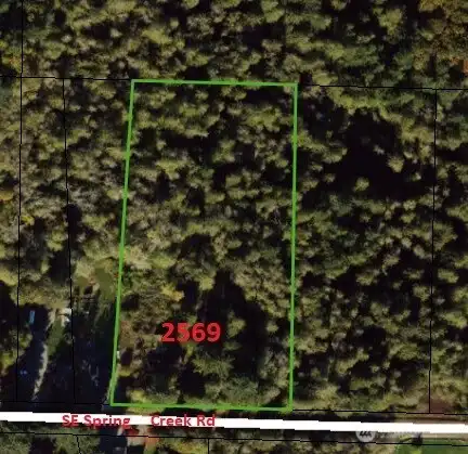 Beautifully wooded 4.73 acres, just a mile from Hwy 16