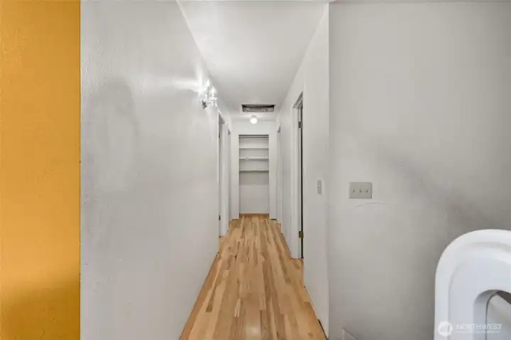 Hallway leading to Primary, 2 bedrooms and full bath.