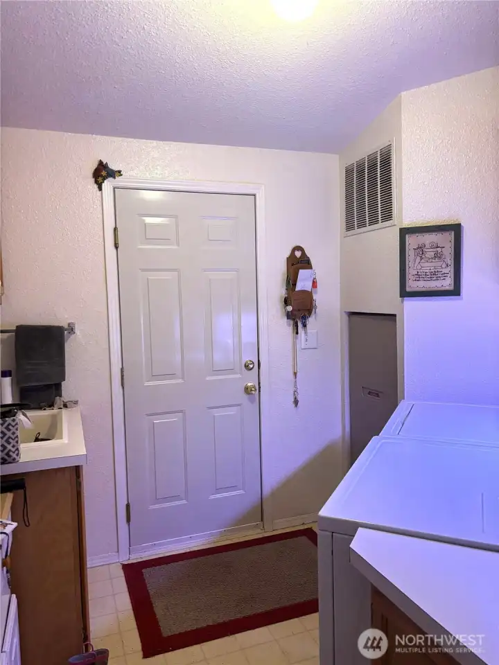 Laundry room with entry to garage