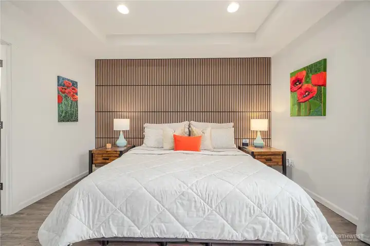 Oversized Primary suite with seating area and tons of natural light.