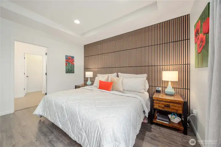 Oversized Primary suite with seating area and tons of natural light.