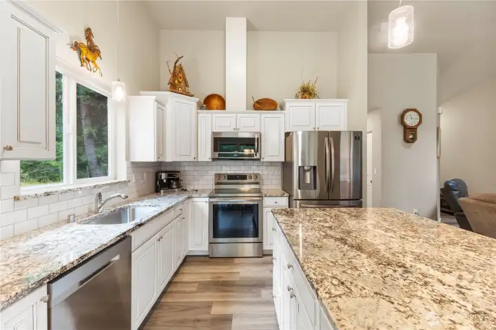 Stainless steel appliances, handsome cabinetry & granite countertops are some of the many upgrades in this mountain home.