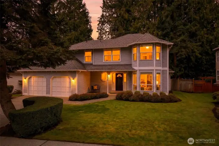 Warm interior lighting and updated exterior fixtures create a standout evening presence, a comfortable arrival home after busy days on the Eastside.