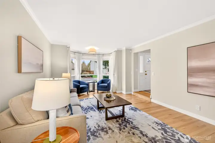 An open, flowing main level makes it easy to move between living spaces, with consistent hardwood finishes, updated lighting, and polished trim details that elevate the presentation.