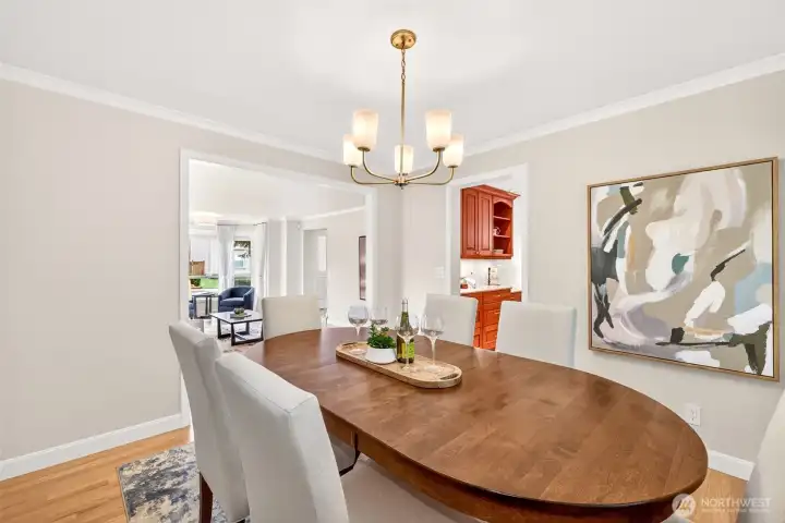 Designed for easy entertaining, the dining room connects naturally to both the living area and kitchen, creating a comfortable layout for gatherings and everyday meals.