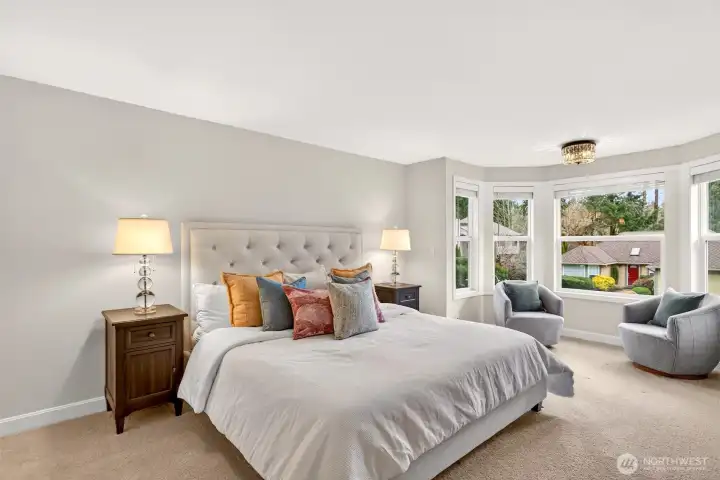 The primary bedroom offers generous space and a bright bay window, with the added value of an updated walk in closet and a private full bath for everyday comfort.