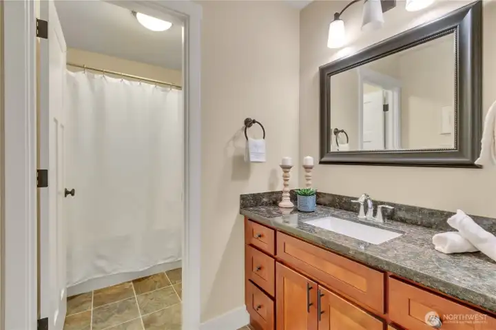 Full bath with tub & shower; oversized vanity!  Located between two side bedrooms for ease.