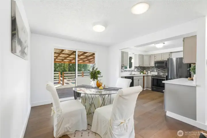 The dining area is well-positioned within the home, offering an easy flow for both daily meals and gatherings. Natural light enhances the space, making it feel open and inviting.