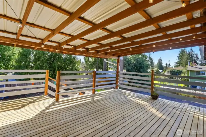 Just off the dining area, access to the covered deck creates a seamless indoor-outdoor connection. This setup is perfect for hosting, allowing guests to move easily between spaces.