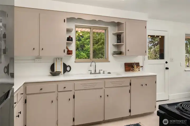 Kitchen looks over back yard