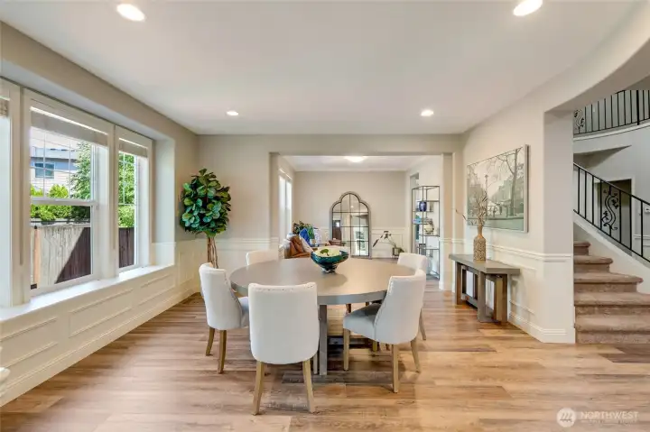 Enter into a foyer that opens to the formal dining and living rooms.