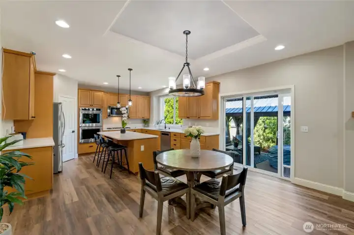 Breakfast nook and slider out to awesome deck and cabana.