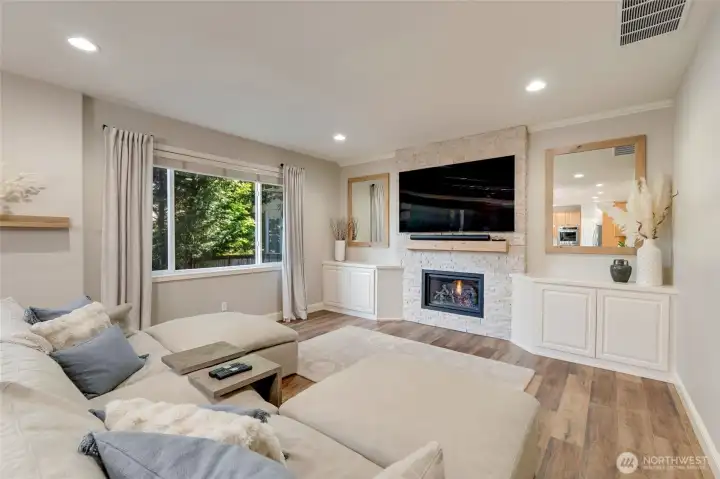Remodeled family room with built in storage and new gas insert/mantle.