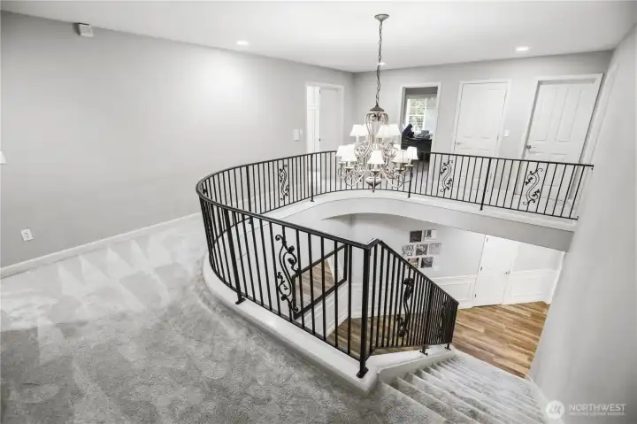 Beautiful railing and chandelier.