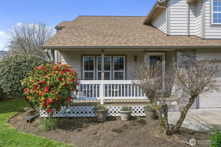 This flowering Camillia is stunning this time of year! Pretty landscaping has several "late bloomers" so you're still in for a treat this Spring!