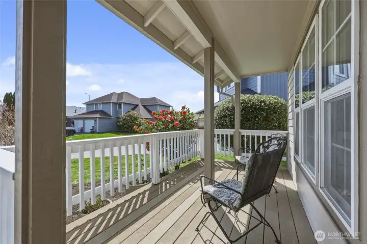 Extended front porch is made of composite decking; wonderful spot to enjoy the peaceful neighborhood, and listen to the frogs and crickets sing in the evenings.