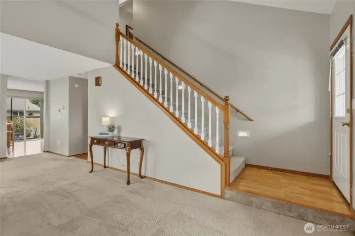 Hardwood entry and vaulted ceiling welcome you inside!