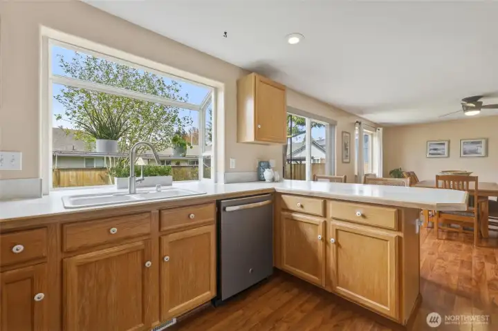 Open to the family room and with wide views of the lovely backyard, this is a kitchen you can delight in.