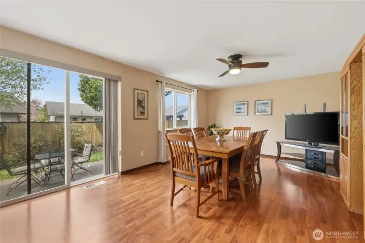 This is typically the family room, used by this homeowner as a larger dining room for those big family gatherings! The slider allows terrific access to the inviting yard and patio.