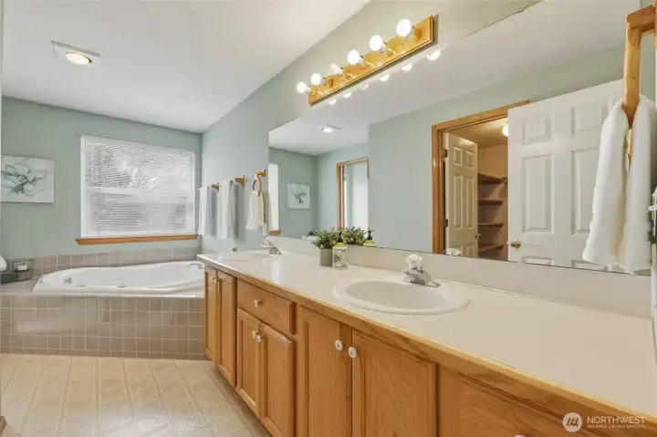 Dual vanity provides maximum storage and two sinks; long mirror adds brightness!