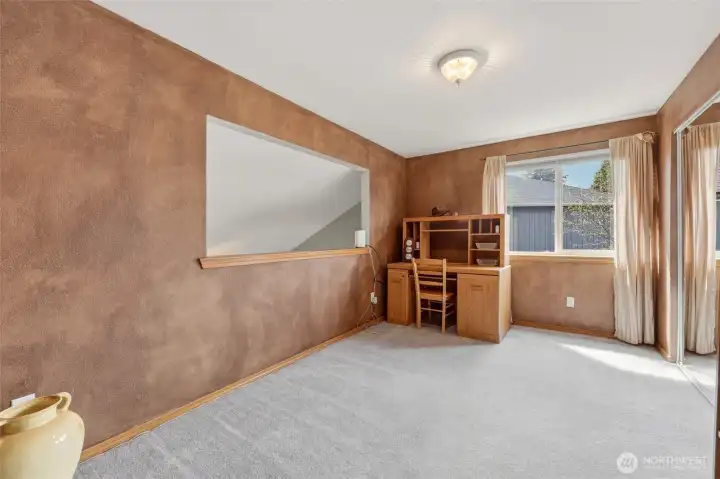 This shows the open area to the living room below--a fun and clever detail to connect the two levels. (It would be a simple project to add drywall to enclose this for a 4th bedroom or more private space!)