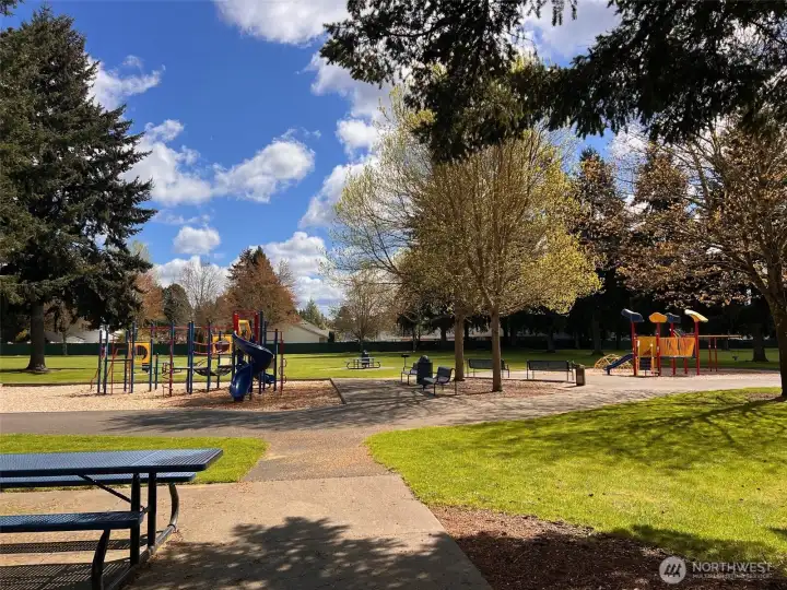 Nearby Thornbury Park is just a couple blocks away, offering playgrounds, picnic tables, covered gathering spot, paths, and expansive grassy area with trees.