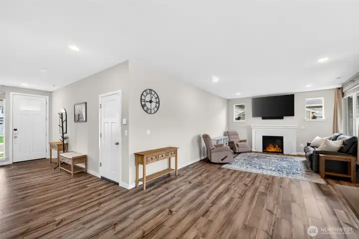 Open concept layout seamlessly connects the entry, great room, kitchen and dining area