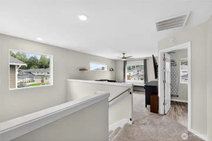 Light and bright upstairs landing leads to bonus room