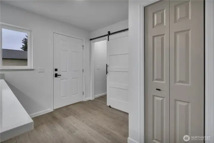 Door to side deck and W/D combo behind the sliding door