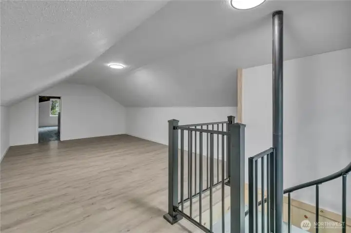 Bonus Room: This space features an additional unfinished area accessible through the door