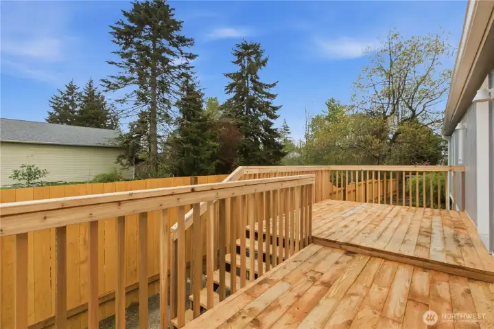 Large deck accessible directly from the kitchen, perfect for outdoor dining and entertaining
