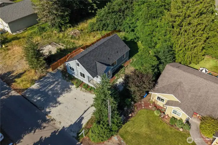 Aerial view showing ample parking and the house set back from the street