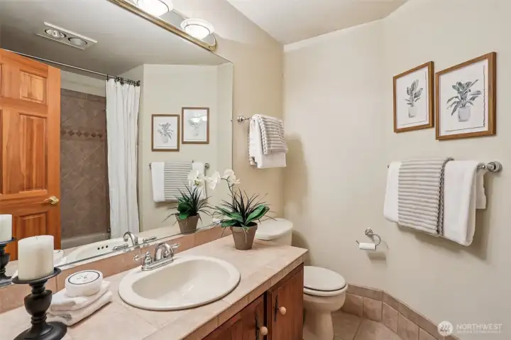 Full bathroom on the main level, great for guests to have their own space. Full bathroom on the main level, great for guests to have their own space.