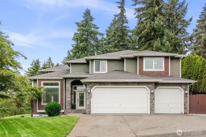Picture Perfect Craftsman with stone accents and entry archway.