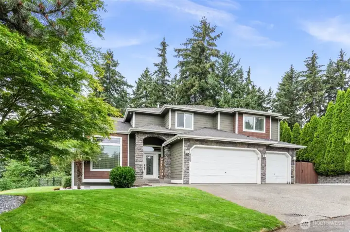 Impeccable Curb Appeal with mature clean landscaping.