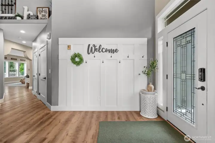 Welcome to an entryway adorned in board and batten for timeless elegance.