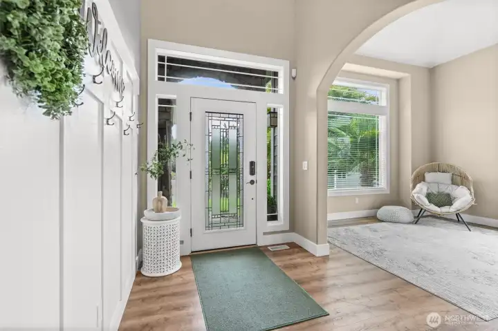 Detailed glass front door with clean lines for an inviting feel.