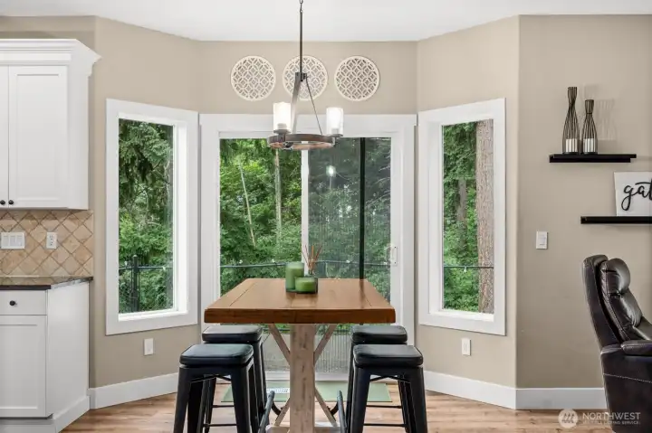 Kitchen Nook that is large enough to accommodate a big group in a bright space for morning breakfast.