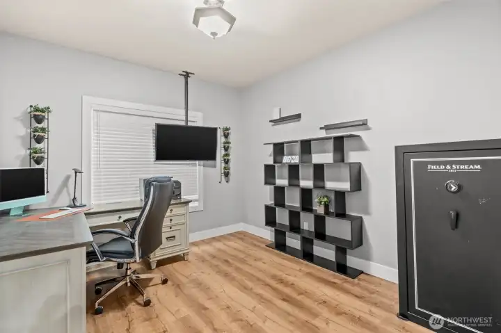 Office sits in private corner of the house where one can work in a quiet environment. This room also houses custom whole house security system.