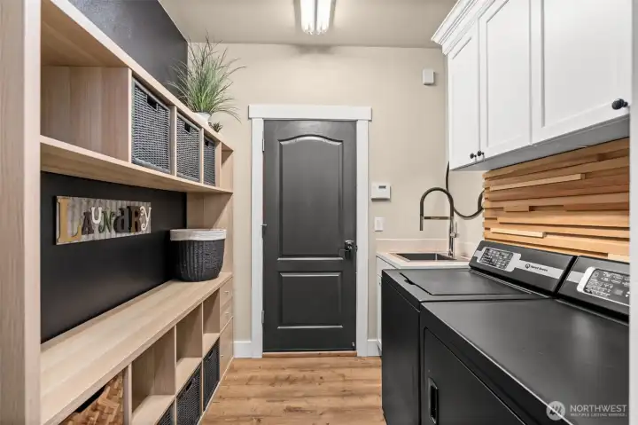 This laundry room is perfect balance between beauty and functionality. W&D do not convey.