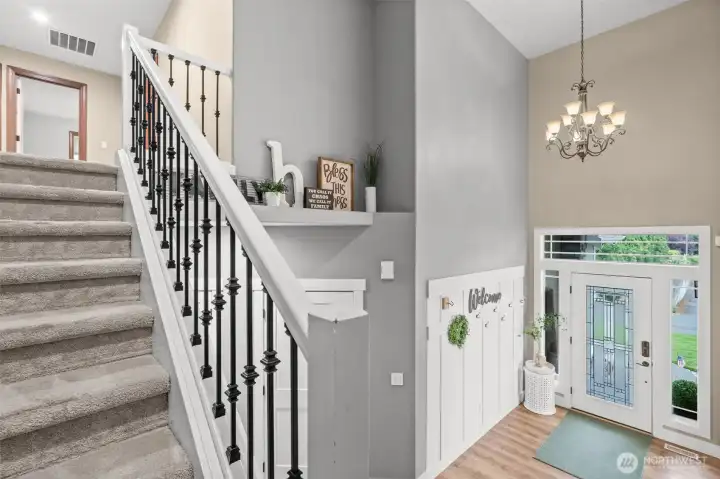Updated stairwell is a perfect segway from main floor to bedrooms and flex space.