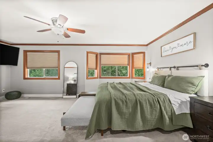Xtra Large Primary retreat with double-sided fireplace, with plenty of natural light, overlooking treeline for total privacy.