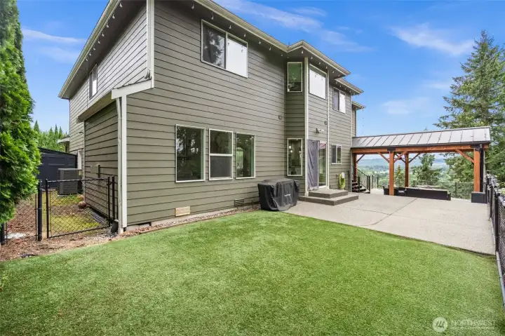 Enjoy turf adjoined to patio for easy maintenance.