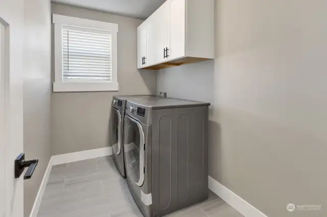 Love that the laundry room is upstairs by all the bedrooms so you’re not constantly having to bring laundry up and down the stairs all the time!