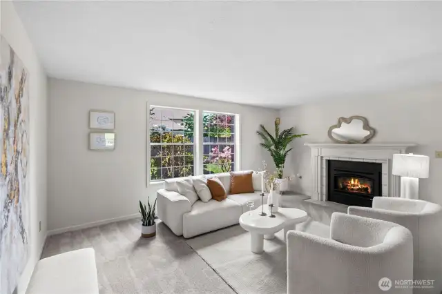 The living room welcomes you with large windows to let in the light.