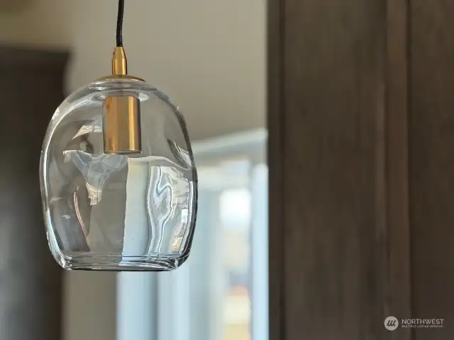 Custom pendants in kitchen. Picture of lights in similar home for reference.