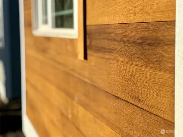 Hemlock accent siding ready for sealing. Picture of siding on similar home for reference.