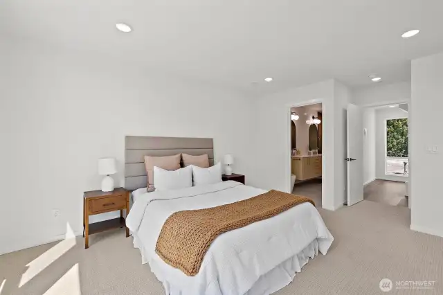 Another view of the spacious primary suite! Model home. Colors and finishes may vary.