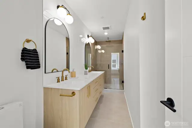 Primary bath with dual sinks! Model home. Colors and finishes may vary.